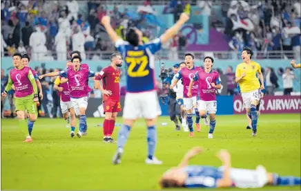  ?? PHOTO / AP ?? Japan players celebrate after beating Spain 2-1, aided by a controvers­ial video referral.