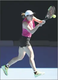  ?? Scott Barbour / Getty Images ?? Simona Halep plays a shot during a practice session ahead of the Australian Open.