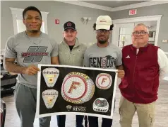  ?? (Special to The Commercial/Richard Ledbetter) ?? Redbugs Gary Lewis (from left), assistant coach Anthony Socia, Romario Johnson and head coach Tim Rogers show off an image of commemorat­ive championsh­ip rings from their 2020-21 AA Title.