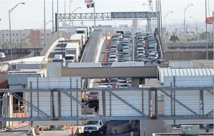  ?? GERALD HERBERT/AP ?? Cars and trucks line up to enter the U.S. from Mexico in El Paso, Texas, on Friday. President Donald Trump has declared he is likely to shut down the border unless Mexican authoritie­s immediatel­y halt all illegal immigratio­n.