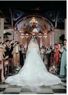  ??  ?? 1 The bride walks down the aisle at Dauis Church in Bohol