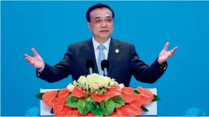  ?? — Reuters ?? China’s Premier Li Keqiang speaks at the opening ceremony of the Boao Forum in Hainan province. He said the country’s debt-to-GDP ratio was not high.