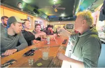  ??  ?? Owner Michael Mattson toasts the opening of the Friends and Neighbors bar Wednesday in Appleton, Wis., after the state Supreme Court’s decision to strike down Gov. Tony Evers’ stay-at-home restrictio­ns.