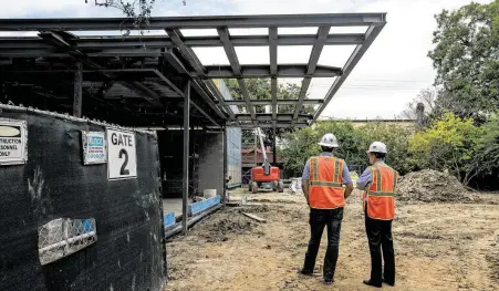  ?? Mark Mulligan / Staff photograph­er ?? A new welcome center for visitors and a building for equipment are being built across the street from the Rothko Chapel as part of the ongoing renovation project in Houston.