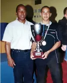  ?? ?? Lewis Hamilton aged 14 with his father, Anthony, after winning the Industrial Championsh­ip for karting in Parma, Italy, in October 1999. Photograph: Shuttersto­ck