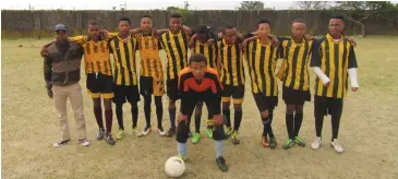  ?? Supplied Photo: ?? The Nombulelo Secondary School soccer team with their coach Siyathemba Melitafa.