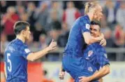  ?? AP ?? n Croatia's Domagoj Vida (centre) celebrates with teammates after their World Cup qualificat­ion.