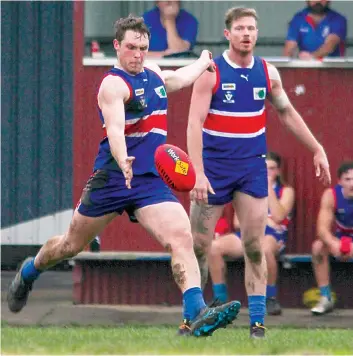  ?? ?? Adam Banks moves to thump the ball forward for Bunyip. Photograph­s by AMANDA EMARY.