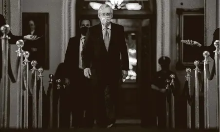  ?? Stefani Reynolds / New York Times ?? Senate Majority Leader Mitch McConnell walks to his office Monday. Lawmakers struck a $900 billion stimulus compromise, but many lawmakers complained the mammoth bill contains too much to read with too many partisan provisions.