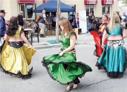  ?? CITIZEN FILE PHOTO ?? Colourful dancers from Zahirah Dance Studio-North perform at an outdoor concert downtown in 2015.