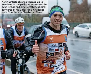  ?? ?? Kevin Sinfield shows a thumbs-up to members of the public as he crosses the Tyne Bridge and into Gateshead during day three of his Ultra 7 in 7 Challenge from Otterburn to Chester-le-Street