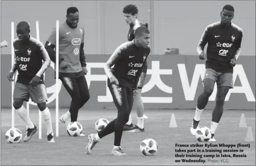  ??  ?? France striker Kylian Mbappe (front) takes part in a training session in their training camp in Istra, Russia on Wednesday.