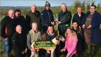  ??  ?? Tom Nolan presenting the Cup to Barney Grines, Mark Mulholland and Brian Murphy Boylesport­s after their dog, South of Here, won the All Age Bitch Stakes at Castleisla­nd Coursing last Sunday.
Photos by David O’Sullivan