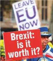  ?? AP & AFP ?? Above: Pro and antiBrexit protesters hold placards near the parliament in London on Friday.Right: Pro-European Union campaigner­s from the Our Future, Our Choice youth movement for a ‘People’s Vote’ on Brexit, launch the group’s campaign battle bus in London yesterday.