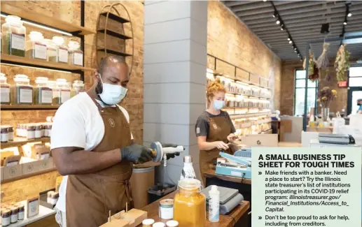  ??  ?? Will McCray vacuum seals bottles of spices before placing them on shelves at the Spice House in Old Town.