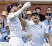  ?? — AP ?? England keeper Johnny Bairstow and Alastair Cook celebrate the fall of a Pakistan wicket.