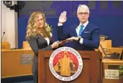  ?? Bryan Chan Los Angeles County ?? GEORGE GASCÓN, with his wife, Fabiola Kramsky, takes the oath as L. A. County’s 43rd district attorney.