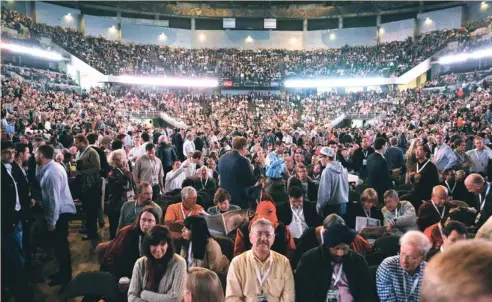  ?? (Rick Wilking/Reuters) ?? BERKSHIRE HATHAWAY shareholde­rs pack the CenturyLin­k arena for the company’s annual meeting in Omaha on Saturday. Whoever ultimately takes over Berkshire will run a conglomera­te that employs more than 280,000 people in dozens of businesses worldwide,...