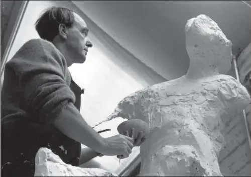  ?? PICTURE: KEYSTONE FEATURES/GETTY IMAGES. ?? FIGHTING CHANCE: Castleford-born sculptor Henry Moore (1898-1986) doing preliminar­y work in plaster on a male figure called The Warrior.