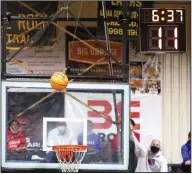  ?? (Arkansas Democrat-Gazette/Justin Cunningham) ?? The shot clock counts down as a shot goes up during a Bryant-Little Rock Central game earlier this season. Coaches across the state are mostly positive about the shot clock as the first full season of its use in Class 6A comes to a close.