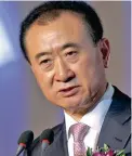  ??  ?? SCORE: Chinese multi-billionair­e Wang Jianlin keeps his eyes on ball.