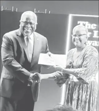  ?? ?? Ruth Osman receives her award from Prime Minister Mark Phillips at the recent Guyana Prize for Literature Awards Ceremony