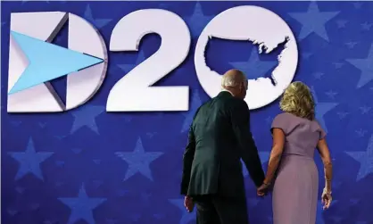  ?? Photograph: Olivier Douliery/AFP/Getty Images ?? Joe and Jill Biden on stage following his speech at the Democratic national convention.