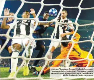  ??  ?? Juventus’ Leonardo Bonucci (2nd right) scores an own goal during yesterday’s Champions League Group H match against Manchester United at the Allianz Stadium in Turin. –