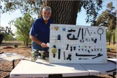  ?? UC MASTER GARDENERS OF BUTTE COUNTY ?? Brent McGhie shows drip irrigation components at a Master Gardener workshop.