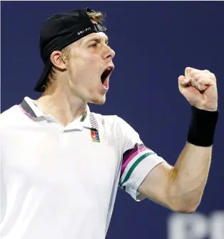  ?? AL BELLO/GETTY IMAGES ?? Canadian teen Denis Shapovalov roars after scoring a point against Frances Tiafoe in quarter-final action at the Miami Open this week. He lost 6-2, 6-4 to Roger Federer in the semis on Friday night.