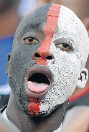  ?? Picture: LEFTY SHIVAMBU/GALLO IMAGES ?? An Orlando Pirates fan sings during the Nedbank Cup final between SuperSport United and the Buccaneers at Peter Mokaba Stadium in Polokwane yesterday. SuperSport won 3-2, lifting the cup for the second time, after leading 3-1 at half-time.