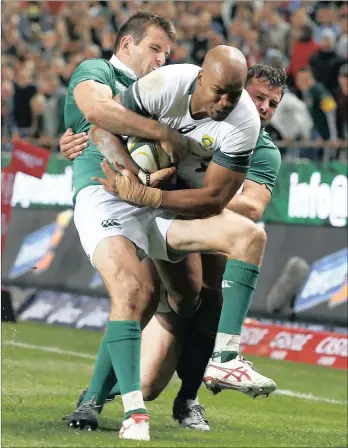  ?? Picture: EPA ?? CRUNCHING: Springbok wing JP Pietersen is tackled by Ireland’s Jared Payne, left, and Robbie Henshaw during yesterday’s Test at Newlands in Cape Town.