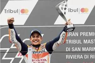  ?? — AP ?? Mark of a champion: Spanish MotoGP rider Marc Marquez celebratin­g on the podium after winning the San Marino Grand Prix in Misano, Italy, yesterday.