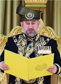  ??  ?? New Ruler: Yang di-Pertuan Agong Sultan Muhammad V taking the Oath of Installati­on to mark the formal start of his five-year reign. — Bernama