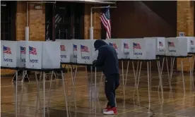  ?? Photograph: Seth Herald/ AFP/Getty Images ?? A resident casts his vote on 3 November 2020 in Flint, Michigan.