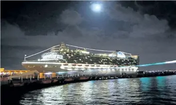  ?? BARB FOX/ SPECIAL TO POSTMEDIA NEWS ?? The Caribbean Princess under a full moon in better days in port at San Juan.