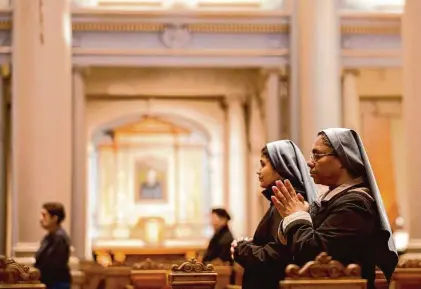  ?? Jessica Christian/The Chronicle 2020 ?? Nuns pray during Mass at St. Ignatius Church. The constraint­s of living as a nun can breed a sense of expansiven­ess.
