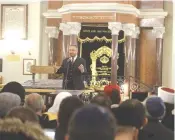  ?? ( Courtesy AJC) ?? RABBI DAVID ROSEN addresses Muslim leaders at Warsaw’s historic Nozyk Synagogue last week.