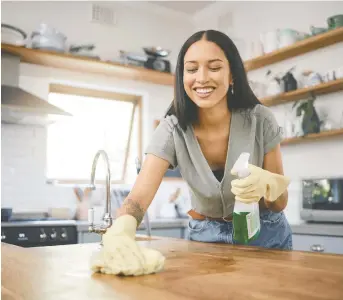  ?? GETTY IMAGES ?? Thoroughly scrubbing countertop­s can prevent gunk from building up. Dana K. White of A Slob Comes Clean suggests running items that have been on countertop­s all winter through the dishwasher.