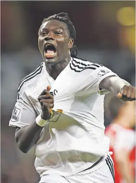  ?? Picture: Reuters ?? CLINCHER. Swansea’s Bafetimbi Gomis celebrates scoring the game’s only goal as they beat Arsenal in a Premier League game at the Emirates Stadium in London last night.