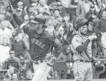  ?? Brett Coomer photos / Houston Chronicle ?? To the dismay of Padres catcher Austin Hedges, right, Josh Reddick crosses the plate with his third home run of the season, a solo shot in the sixth inning that gave the Astros a 4-1 lead Sunday.