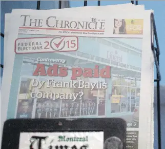  ?? ALLEN MCINNIS/MONTREAL GAZETTE ?? A copy of The Chronicle sits in a newspaper stand in Lachine on Thursday. Transconti­nental has announced it will close the paper, along with the Westmount Examiner.