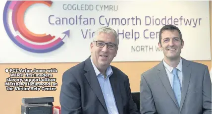  ??  ?? PCC Arfon Jones with Wales’ first modern slavery support officer Matthew Hazlewood at the Victim Help Centre