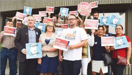  ?? STEVE MACNAULL/The Okanagan Weekend ?? Two dozen federal government employees and union officials protested outside Liberal MP Stephen Fuhr’s office on Friday.