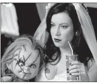  ??  ?? Chucky (left) and Jennifer Tilly co-star in Seed of Chucky on Wednesday as part of AMC’s 20th annual “Fearfest.”