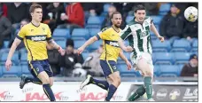  ??  ?? CLEAR: Plymouth’s Anthony O’Connor gets the ball away from Kemar Roofe