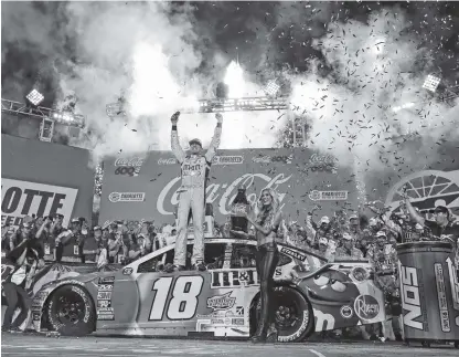  ?? ASSOCIATED PRESS FILE PHOTO ?? Kyle Busch celebrates after winning the NASCAR Cup Series race at Charlotte Motor Speedway last Sunday. Busch’s four wins so far this season are just four shy of matching his career best in 2008.