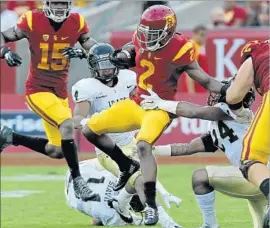  ?? Luis Sinco Los Angeles Times ?? USC’S ADOREE’ JACKSON gets a catch against Idaho during a game last season. Jackson plays offense and defense and is a member of the track team.