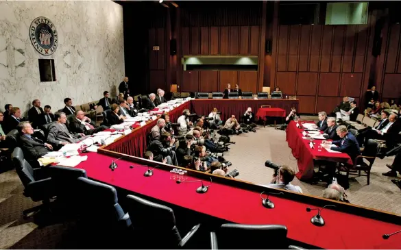  ??  ?? AFTERMATH
Above: Defense Department officials testify before the bipartisan September 11 commission in 2004. Right, from top: Recently arrived refugees at a U.S. military facility in Germany where they’re being housed temporaril­y after fleeing Afghanista­n last month; and a plane flies over the barracks where the refugees are staying.