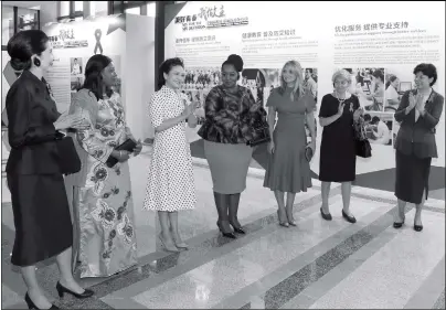  ?? Photo: Xinhua ?? China’s First Lady Peng Liyuan (third from left) applauds as she and the spouses of foreign leaders present at the BRICS summit visit Xiamen University to promote AIDS awareness in Xiamen on Tuesday.